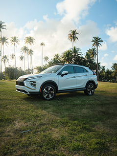 Angled view of a red 2026 Mitsubishi Eclipse Cross compact SUV parked